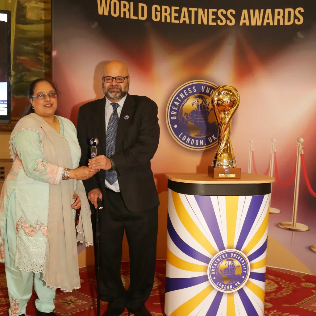 Dr. Farida Sheikh and Asjad Sheikh receiving the Global Greatness Award from Greatness University in London, UK 2020